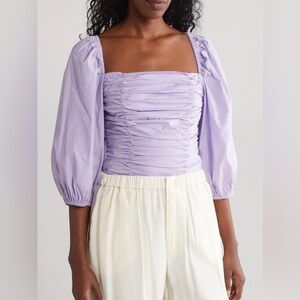 Wayf Gathered Puff Sleeve Stretch
Cotton Top in Purple